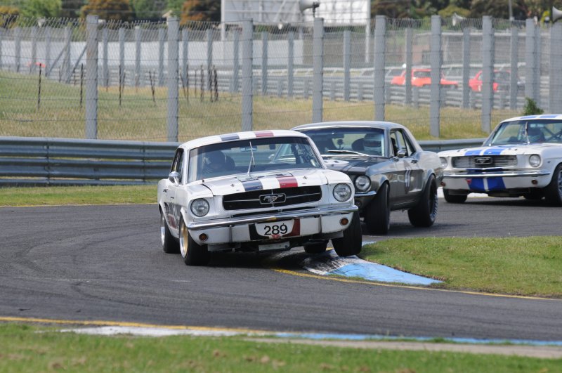 Darrin Davies in the ex-John Mann Mustang led before biffo from behind