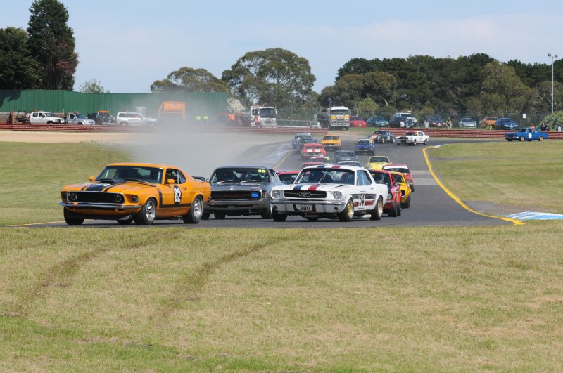 Perry Spiridis, Darrin Davies and Les Walmsley lead the pack into Turn 2