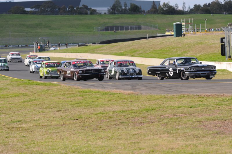 Back marker Allen Boughen powers past Rose's Mustang and Shuttle's Jag