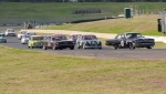 Back marker Allen Boughen powers past Rose's Mustang and Shuttle's Jag