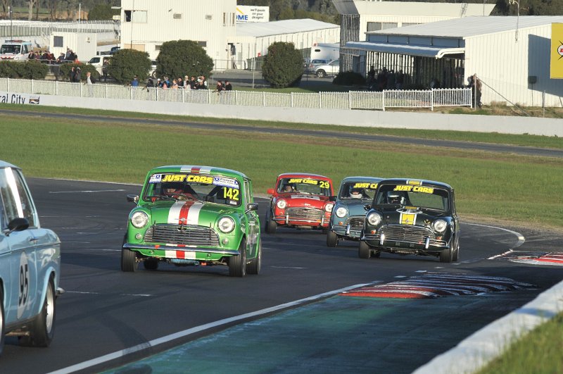 Bug-eyed in the afternoon sun, Minis swarm up pit straight