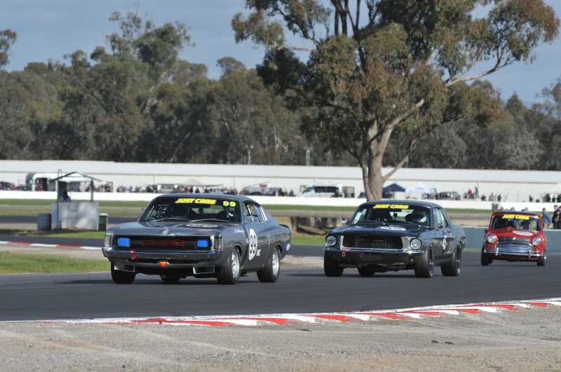 Darryl Hansen's Mustang chases Les Walmsley's Charger