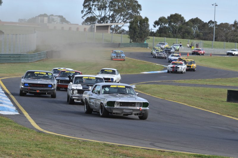 Rod Hotchkin\'s Falcon spins out while ACT\'s Ben Wilkinson leads the pack into Dandenong Rd corner