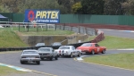 Darrin Davies, Darryl Hansen and Les Walmsley chase Keven Stoopman into Turn 2