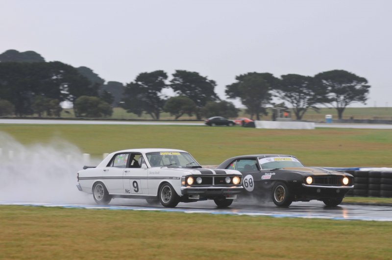 Spud Smith slithers down the inside of Dean Neville at Honda