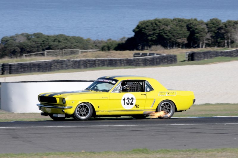 Bob Munday\'s beautiful Mustang barks some flame