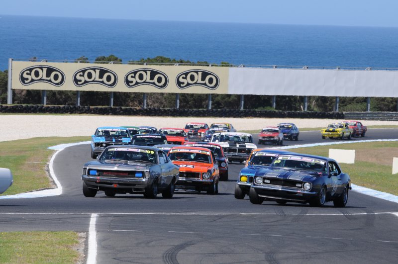Les Walmsley\'s Charger has the inside line into Turn 4