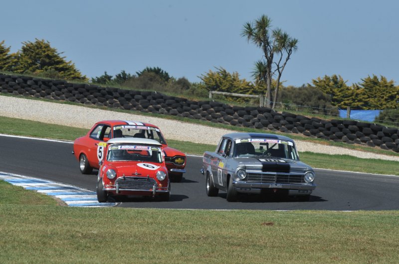 Best Presented Car winner Adrian Read sneaks under Phil Shepherd