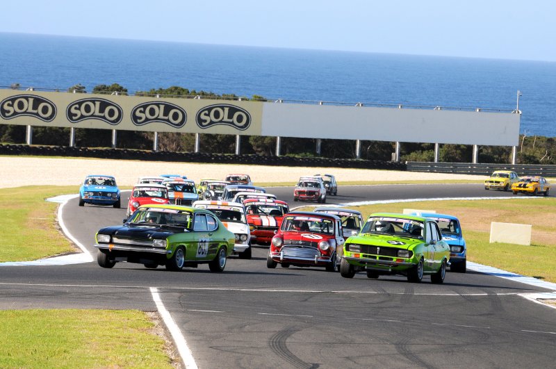 Steve Land\'s Capri leads Jason Armstrong\'s superfast Mini and Ben Read\'s Mazda into Turn 4