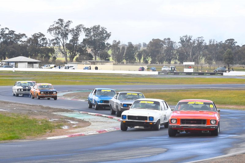 Before the heavens opened. Tessari's Monaro leads the Cup