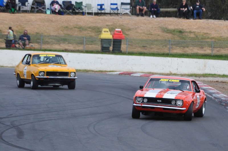 Tony Hubbard gets loose ahead of McKelvie's Torana