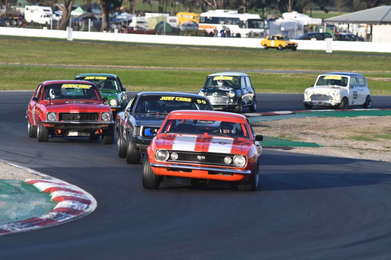 Tony Hubbard's Camaro leads Les Walmsley's Charger, the Toranas of Edwards and Girvan and the Minis of Hill and Ford