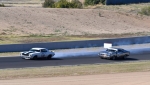 Darren Collins locks a brake on the very last corner and...