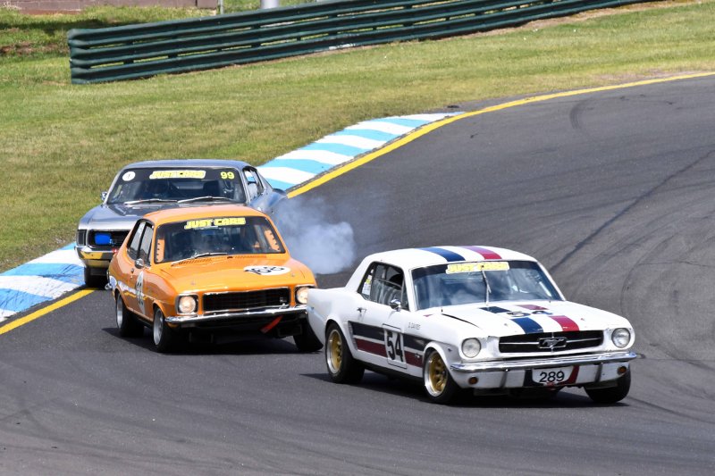 Les Walmsley's Charger locks a wheel chasing Craig Allan's Torana and Darrin Davies' Mustang
