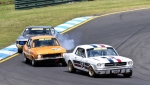 Les Walmsley's Charger locks a wheel chasing Craig Allan's Torana and Darrin Davies' Mustang