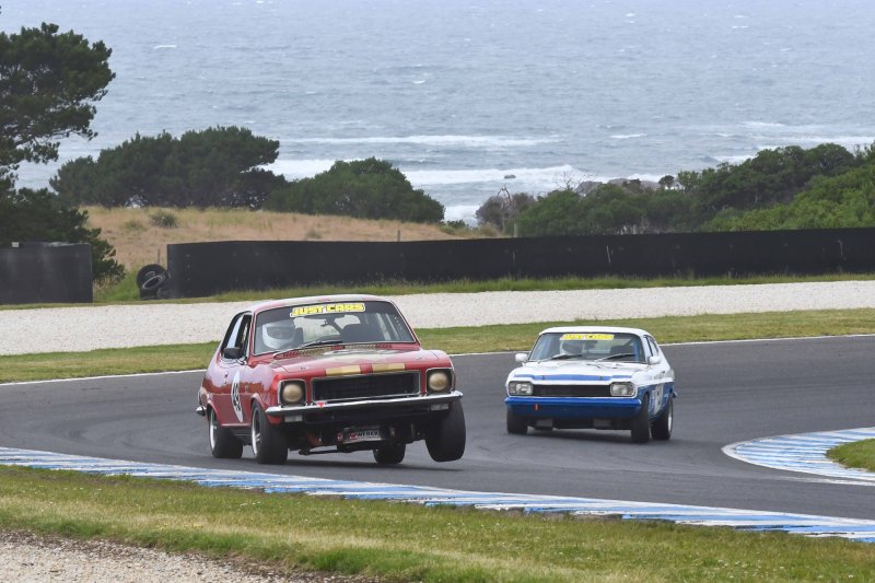 Daniel van Stokrom's Torana lifts a wheel escaping Alex Bland's Capri