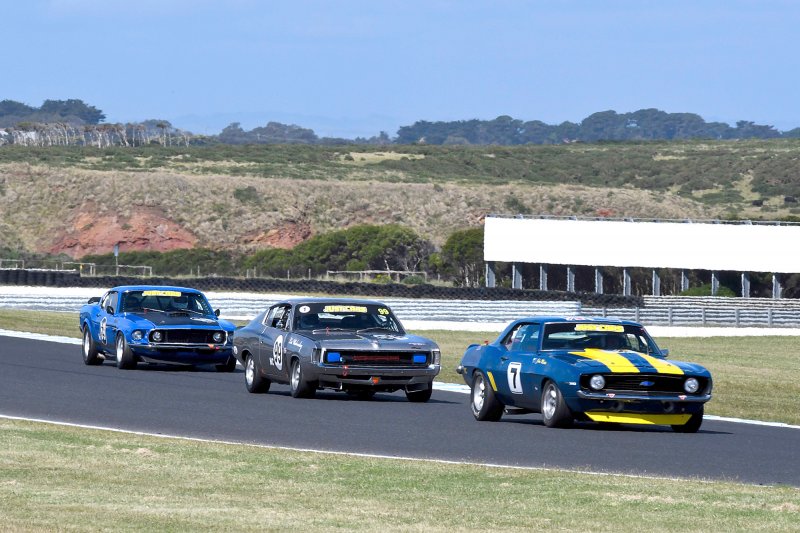 Veteran John Mann's Camaro leads Walmsley's Charger and Miceli's Mustang