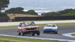 Daniel van Stokrom's Torana lifts a wheel escaping Alex Bland's Capri