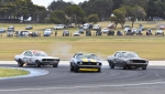John Mann's Camaro in a silver Mustang sandwich