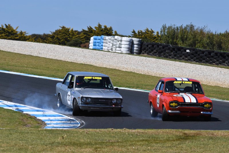 Cruz Cody's Datsun and Peter van Summeren's Twin Cam Escort synchronised into MG Corner