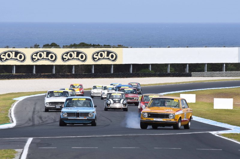 Qld's Jim Schilling, Volvo 142, trying to keep out George Dragovitch's BMW