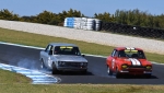Cruz Cody's Datsun and Peter van Summeren's Twin Cam Escort synchronised into MG Corner