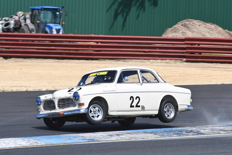 Historic rally man Andy White goes cross country on the Turn 1 kerbs
