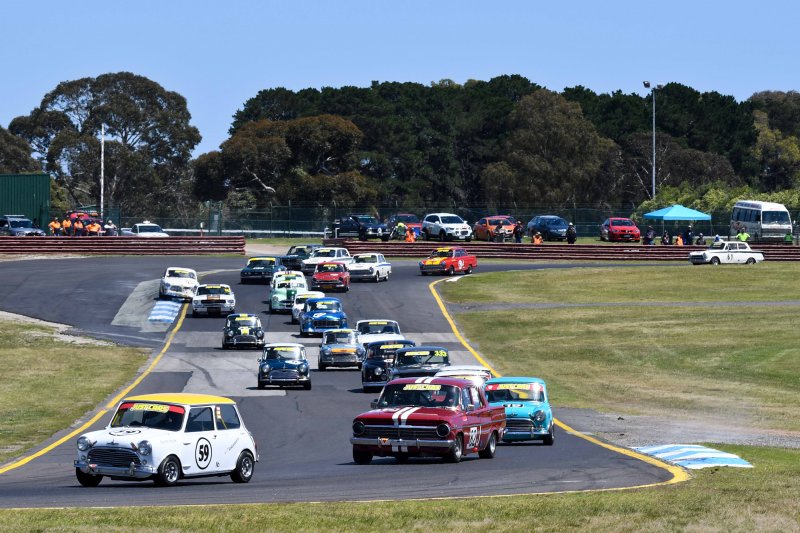 Stephen Hoade leads Claude Ciccotelli's EH and Banny Berry's Mini into Turn 2