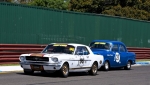 Eddie Dobbs' FE Holden gives John Clarke's Mustang a bit of hurry up