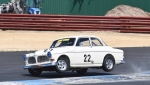 Historic rally man Andy White goes cross country on the Turn 1 kerbs