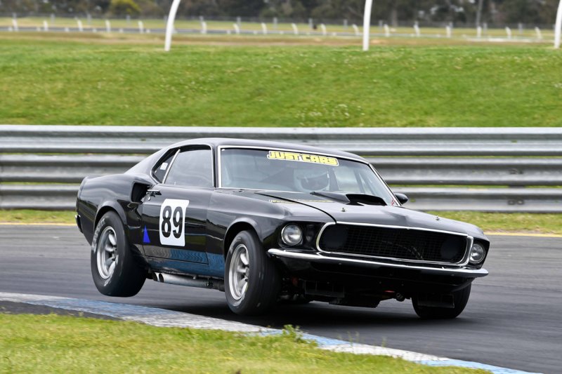 Andrew-Lane-to-wheels-the-beautiful-black-Mustang