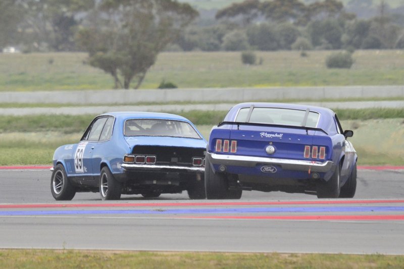 Andy-Williams-passes-Ian-Mewett-for-the-lead-2-laps-to-go-Race-2.
