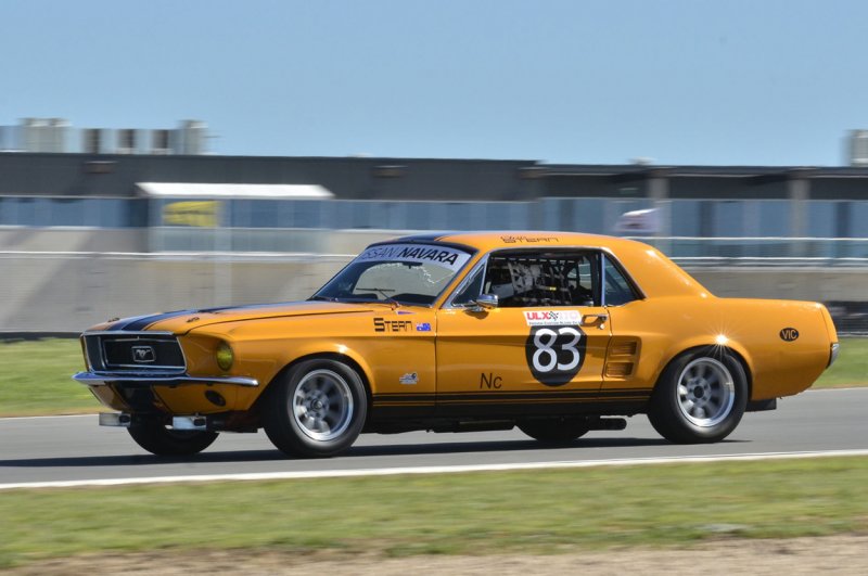 Chris-Stern’s-Mustang-with-the-imposing-pit-building-in-the-distance.