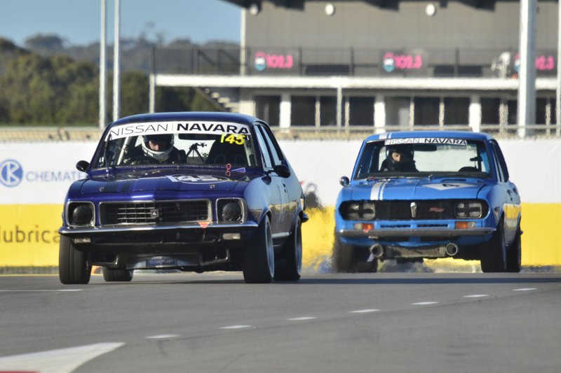 Nathan-Gordon’s-Torana-XU-1-leads-Kirk-Davis’s-Mazda-RX2-up-the-main-straight.