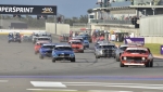 Aldo-De-Paoli-leads-Andy-Williams-and-the-field-into-Turn-1-for-the-first-time.