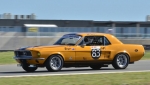 Chris-Stern’s-Mustang-with-the-imposing-pit-building-in-the-distance.