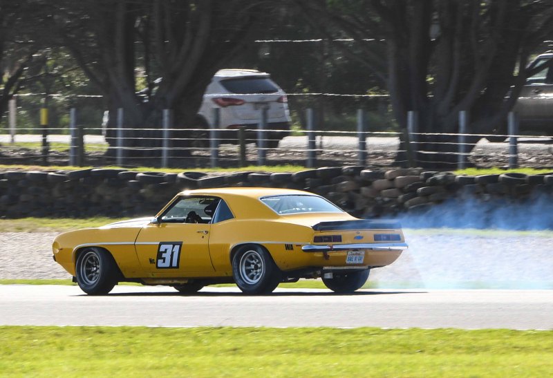 Paul-Stubber-sets-up-his-tyre-smoking-victory-drift-into-T12