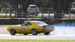 Paul-Stubber-sets-up-his-tyre-smoking-victory-drift-into-T12