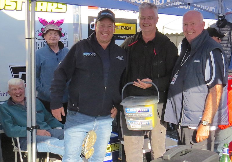 Ted-Brewster-foot-photobombs-Nathan-Gordon-awarding-Craig-Allan-the-Clean-Fleet-Best-Presented-for-the-reborn-ex-Hunt-Stillwell-Hansen-Fastback-Mustang