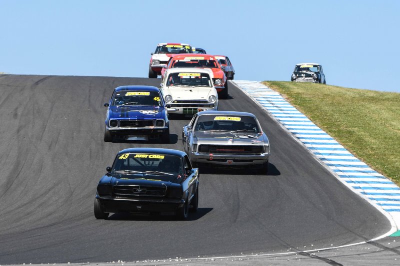 Black-beauty-Champ-in-waiting-Pete-Mueleman_s-Mustang-dives-into-MG-Corner.-Phil-Wisewould-photo