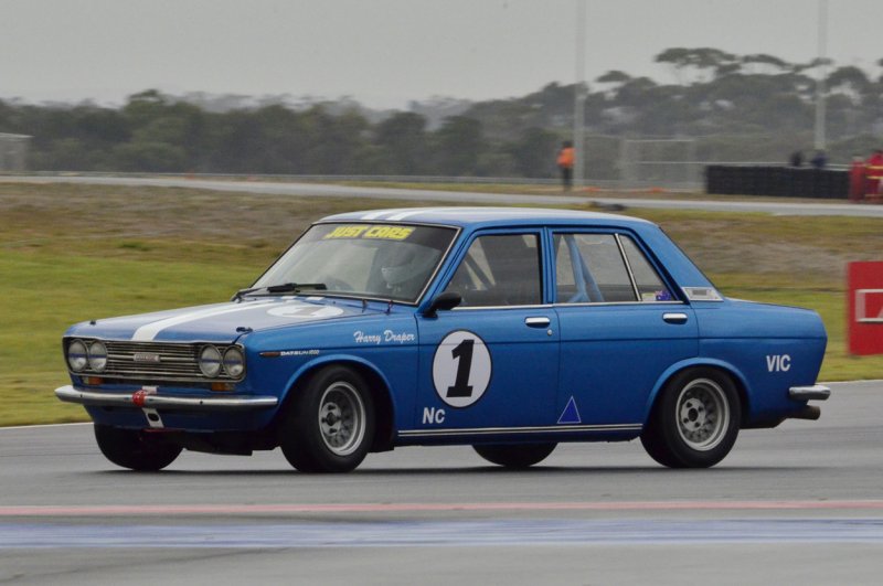 Harry-Drapers-giant-killing-Datsun-1600-squirms-under-brakes-in-Saturdays-damp-opening-race.