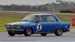 Harry-Drapers-giant-killing-Datsun-1600-squirms-under-brakes-in-Saturdays-damp-opening-race.
