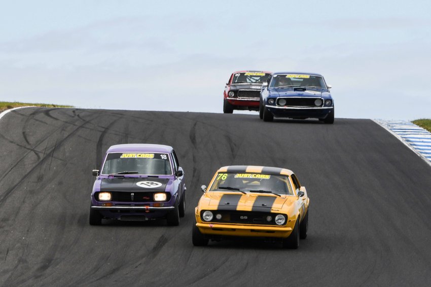 Makulu-Driver-of-the-Meeting-Darren-Hossack-rips-his-Mazda-under-Trevor-Talbot_s-Camaro