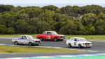 David-Brown_s-Datsun-leads-the-BMWs-of-Rob-van-Stokrom-and-Justin-Brown-in-Under-2-Litre-clash.