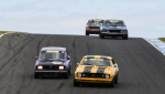 Makulu-Driver-of-the-Meeting-Darren-Hossack-rips-his-Mazda-under-Trevor-Talbot_s-Camaro