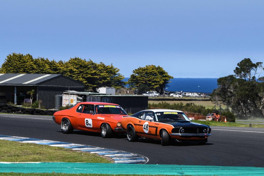 Marc-Tessari-sniffing-for-a-pass-on-Darryl-Hansen_s-Mustang.