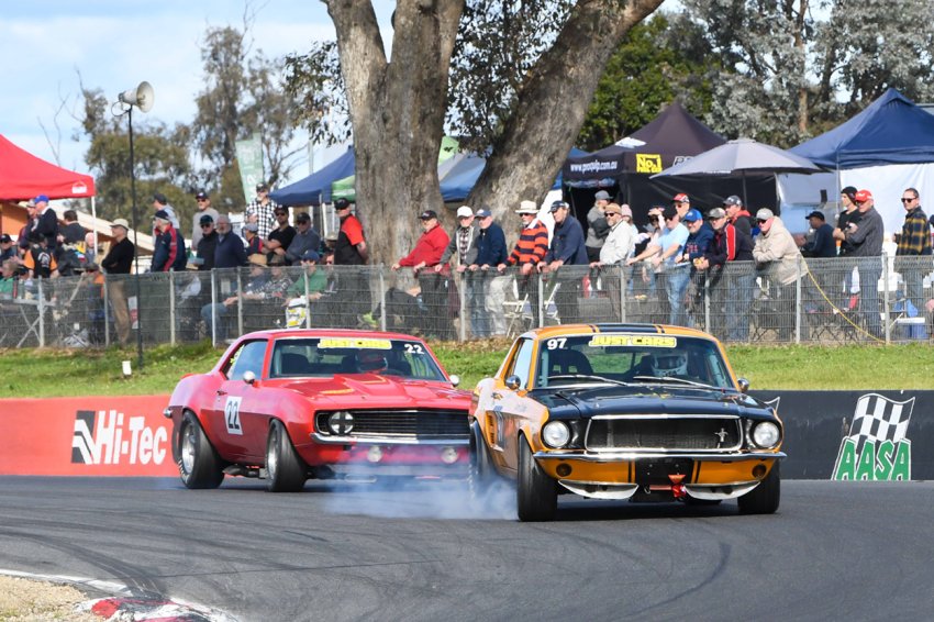 Darren-Collins-locks-up-keeping-the-Mustang-in-front-of-Brent-Tregrove_s-Camaro