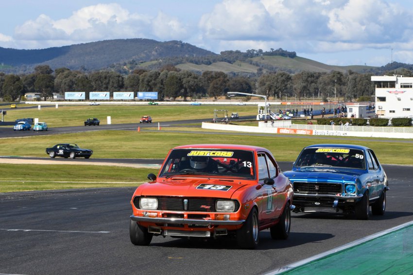 The-podium-battle-was-fierce-between-Peter-McNiven_s-Mazda-and-Andrew-Williams_-Torana