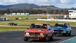 The-podium-battle-was-fierce-between-Peter-McNiven_s-Mazda-and-Andrew-Williams_-Torana