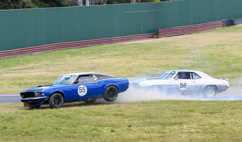 Ian-Mewett_s-hungry-Mustang-gobbles-a-cone-as-Andrew-Beard-watches